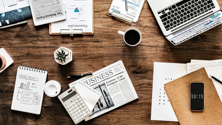 desk with business items and coffee
