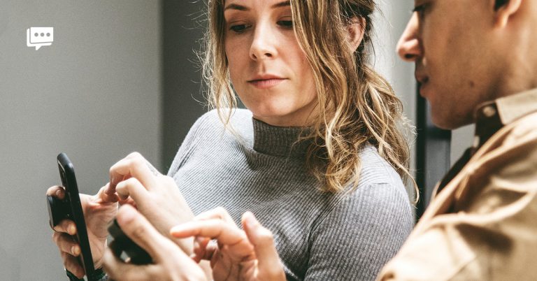 woman looking at smartphone
